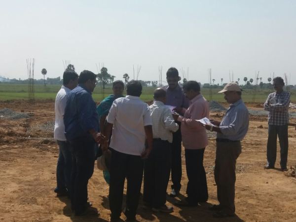 Officials reviewing drawings on site